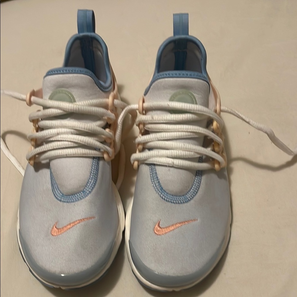 Nike Blue and White Sneakers with Sleek Silhouette